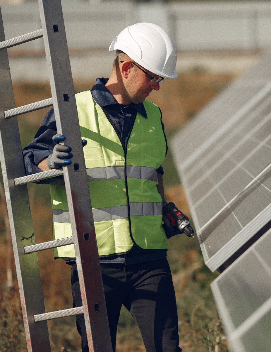 man-with-white-helmet-near-solar-panel-2
